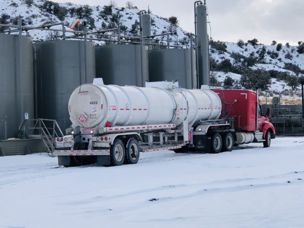 Image of an Equipment Transport fuel truck representing our surge capability. Equipment Transport is a leading provider of midstream logistics solutions.