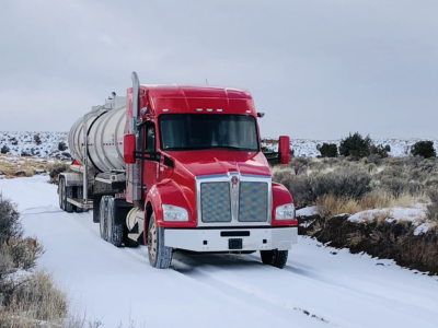 Image of an Equipment Transport fuel truck representing our nationwide footprint in major energy producing regions of the country, including Marcellus, Eagle Ford, Permian, Uinta, and Wyoming. Equipment Transport is a leading provider of midstream logistics solutions.
