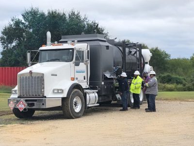 Image of an Equipment Transport hot oiler truck that provides the capability to perform hot oil transport. Equipment Transport is a leading provider of midstream logistics solutions.